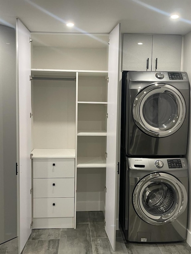 washroom with stacked washer / drying machine