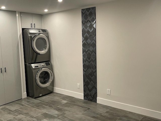 laundry area with stacked washing maching and dryer