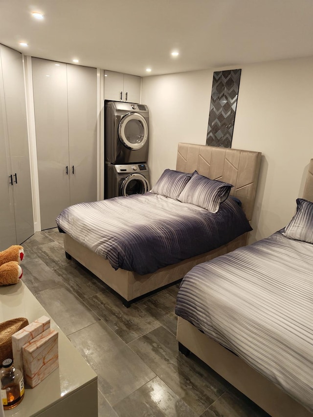 bedroom with stacked washer and clothes dryer