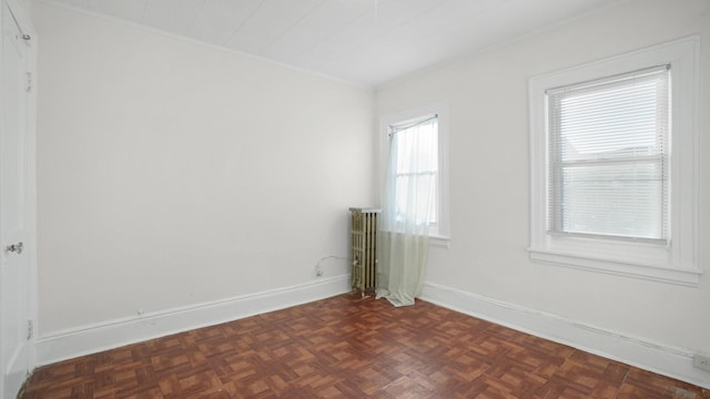 empty room with dark parquet flooring