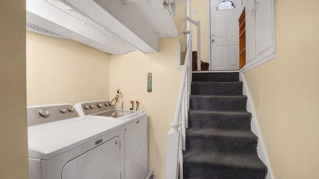 laundry area with independent washer and dryer