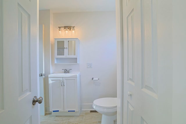 bathroom with vanity and toilet