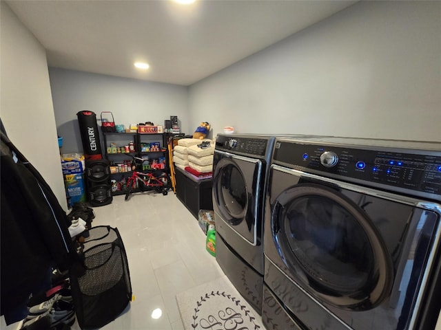 clothes washing area with independent washer and dryer