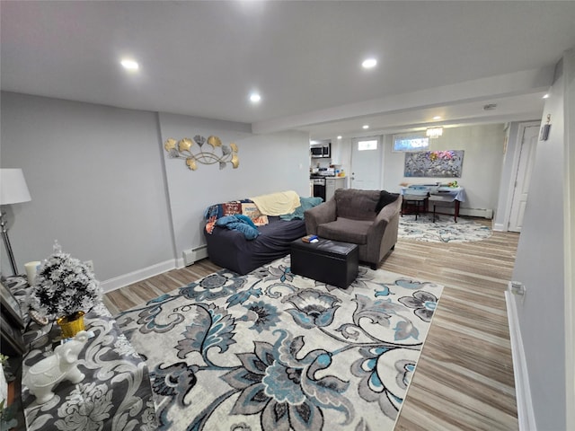 living room featuring light hardwood / wood-style flooring and a baseboard radiator