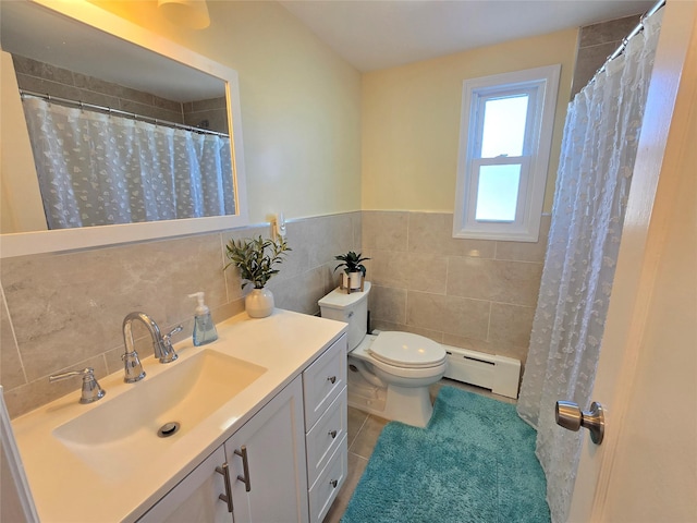 bathroom featuring vanity, a baseboard radiator, tile walls, tile patterned flooring, and toilet