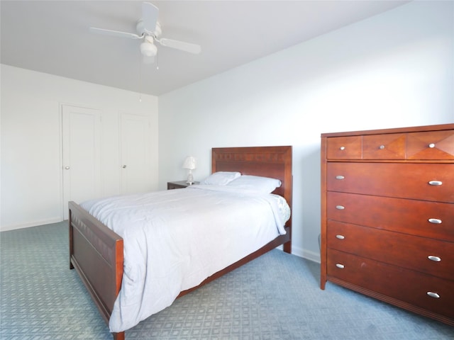 bedroom featuring ceiling fan and light carpet