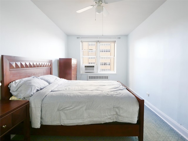 bedroom with ceiling fan, radiator heating unit, and carpet