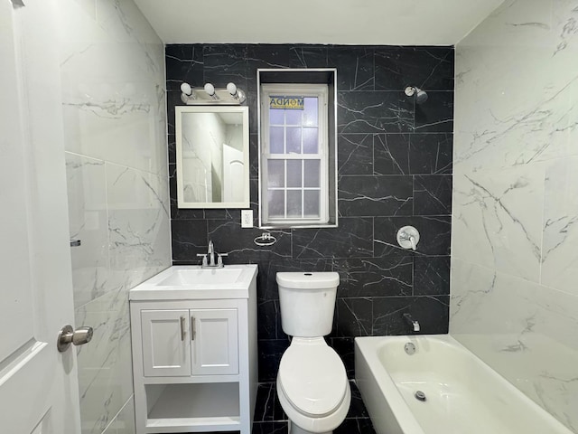 full bathroom with tiled shower / bath, vanity, tile walls, and toilet