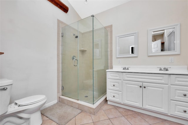 bathroom with vanity, tile patterned floors, vaulted ceiling, toilet, and an enclosed shower