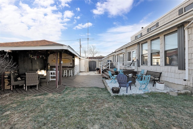 view of yard with a storage unit and a deck