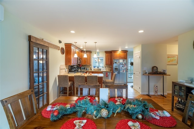 dining room with light hardwood / wood-style flooring