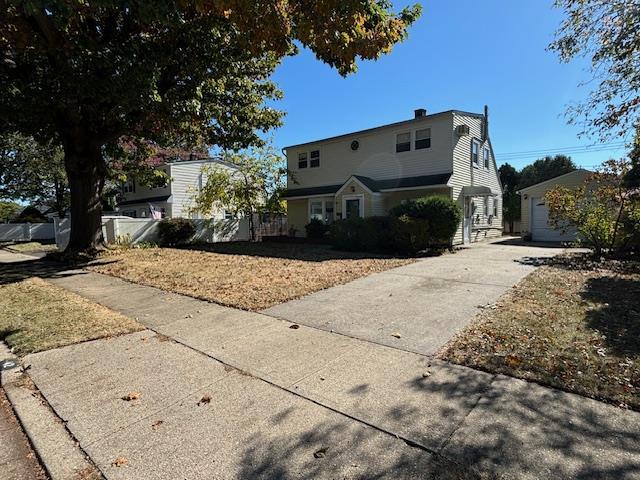 front of property featuring an outbuilding and a garage