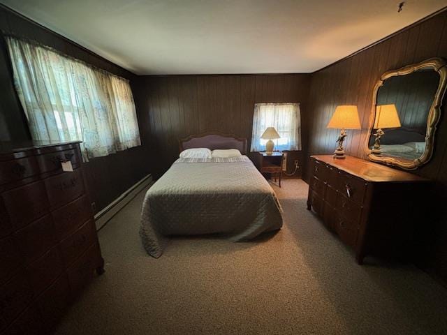 bedroom with wood walls, light colored carpet, and a baseboard radiator