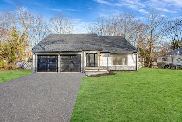 view of front facade featuring a garage and a front lawn