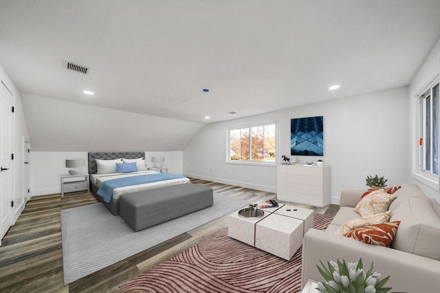 bedroom with dark hardwood / wood-style floors and vaulted ceiling