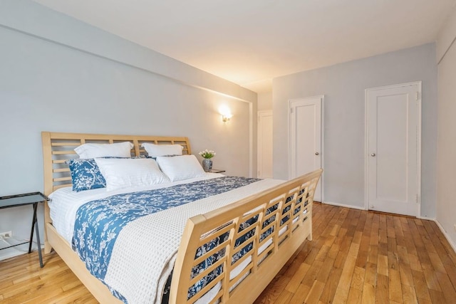 bedroom with light wood-type flooring