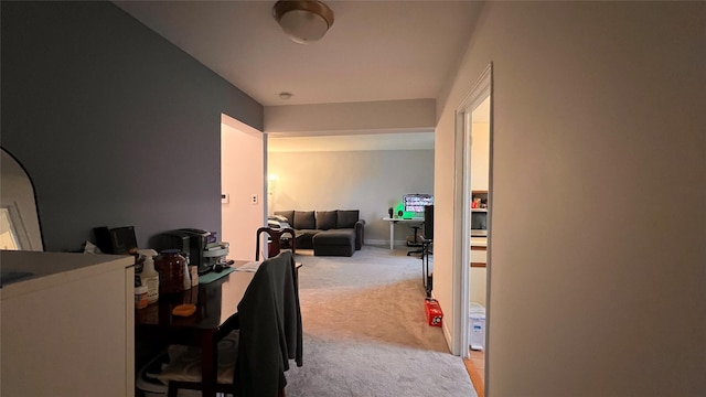 dining area featuring light carpet