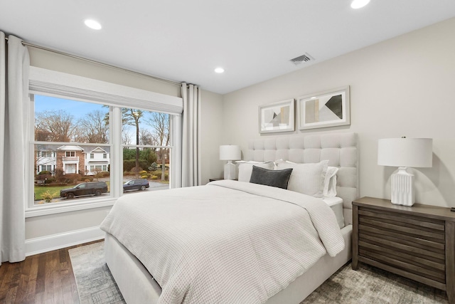 bedroom with wood-type flooring