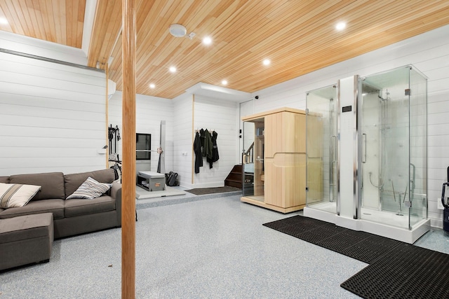 workout room featuring wood walls and wood ceiling