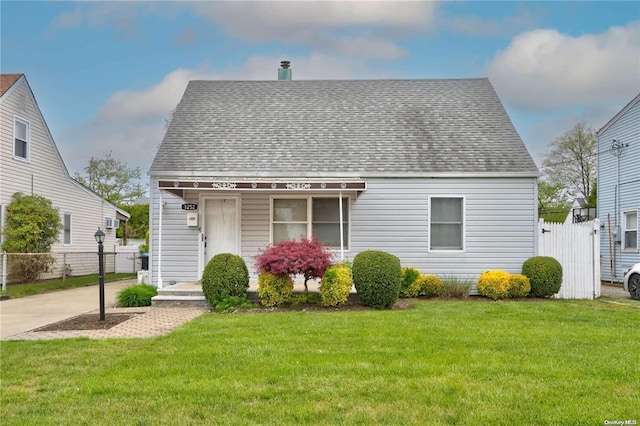 bungalow-style house with a front lawn