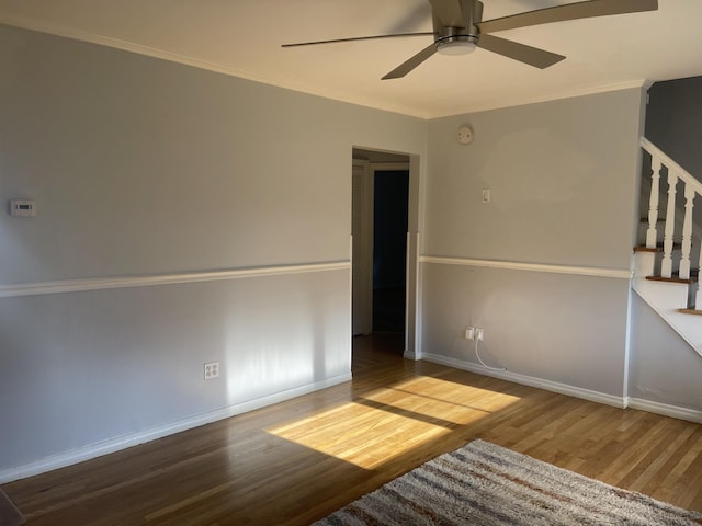 unfurnished room with ceiling fan, ornamental molding, and hardwood / wood-style flooring