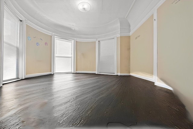 unfurnished room featuring hardwood / wood-style floors and ornamental molding