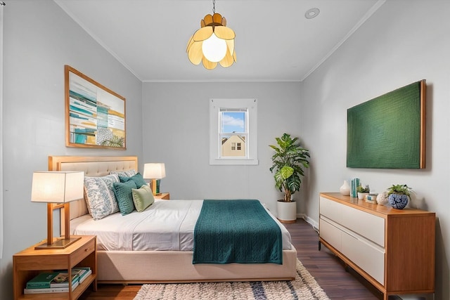 bedroom featuring crown molding and dark wood-type flooring