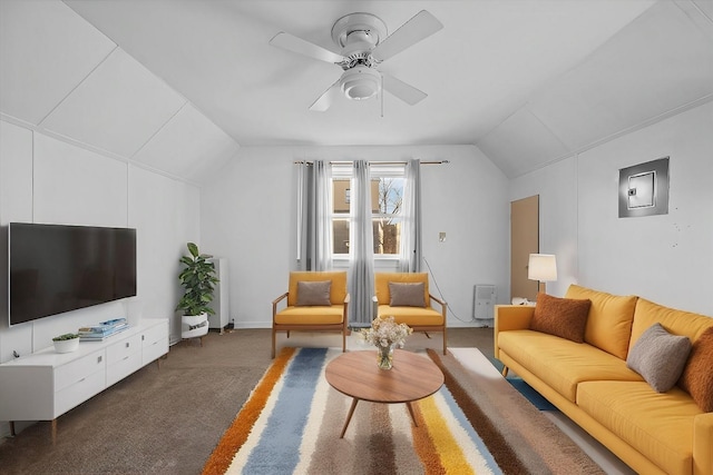 living room with dark colored carpet, electric panel, ceiling fan, and lofted ceiling