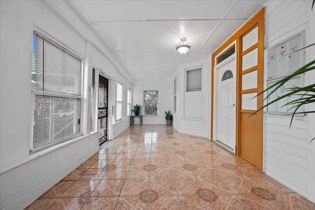 hallway with light tile patterned floors