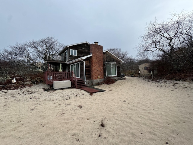 view of property exterior with a deck