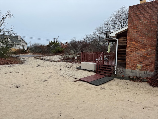 view of yard featuring a wooden deck