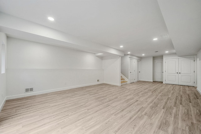 basement featuring light hardwood / wood-style flooring