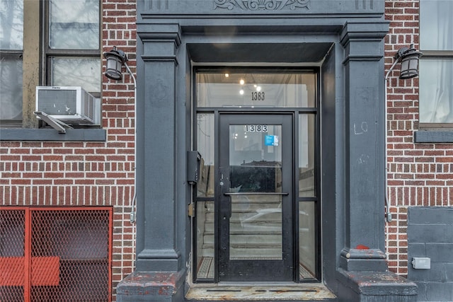 doorway to property with cooling unit