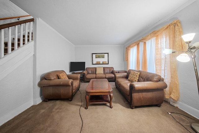 carpeted living room featuring ornamental molding