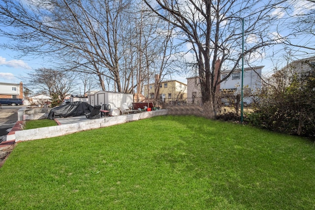 view of yard with a storage shed