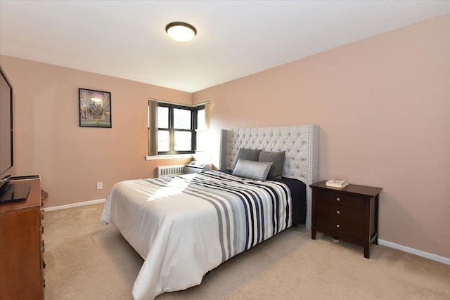 carpeted bedroom featuring radiator