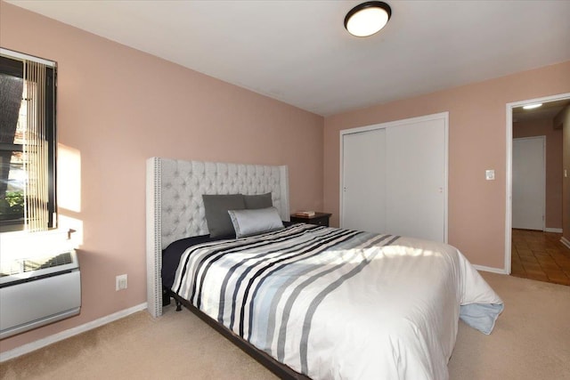 bedroom with light carpet and a closet