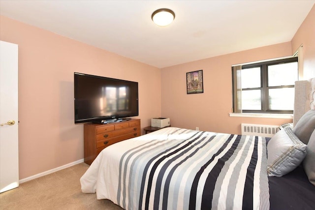 carpeted bedroom with radiator