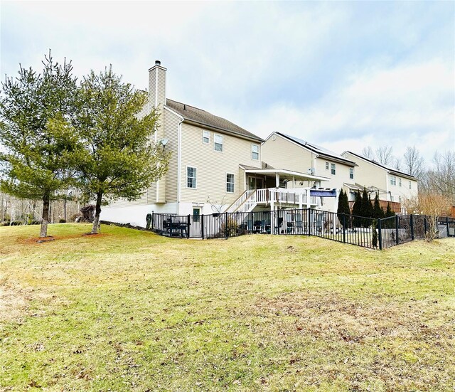 back of house with a yard