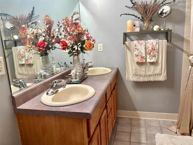 bathroom featuring tile patterned flooring and vanity