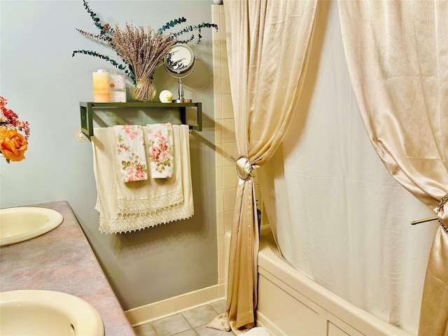 bathroom with tile patterned floors, vanity, and shower / tub combo with curtain