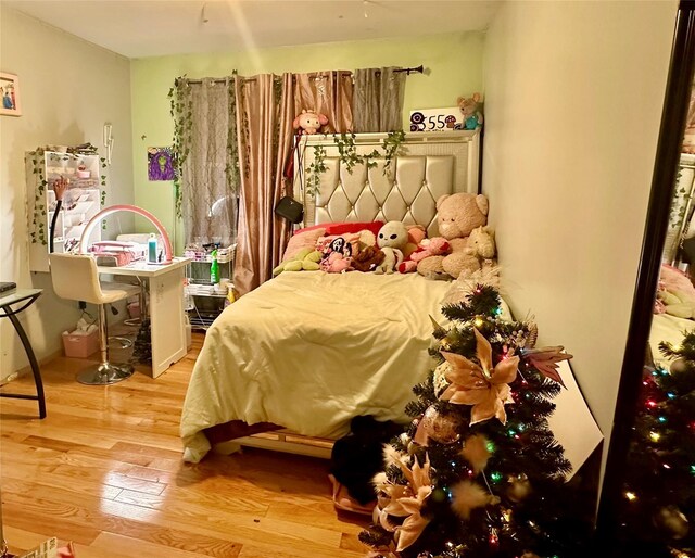 bedroom featuring wood-type flooring