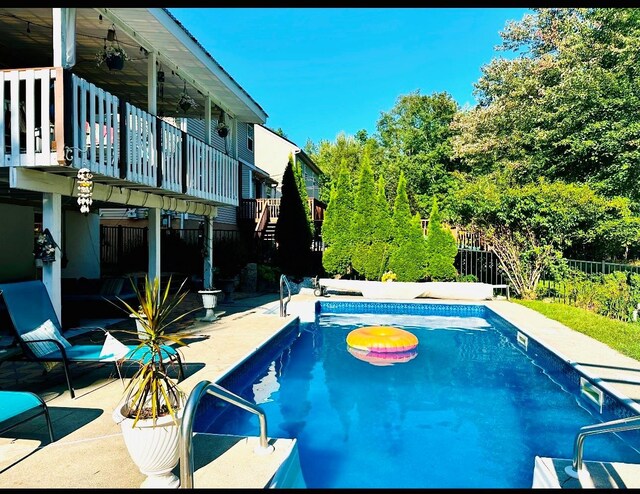 view of swimming pool featuring a patio