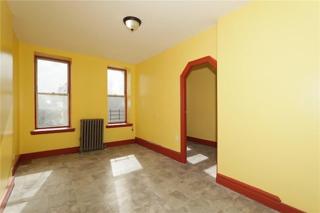 empty room featuring radiator heating unit