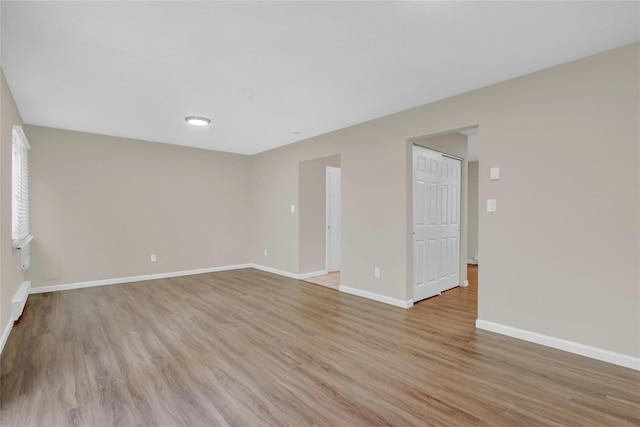 unfurnished room featuring light wood-type flooring