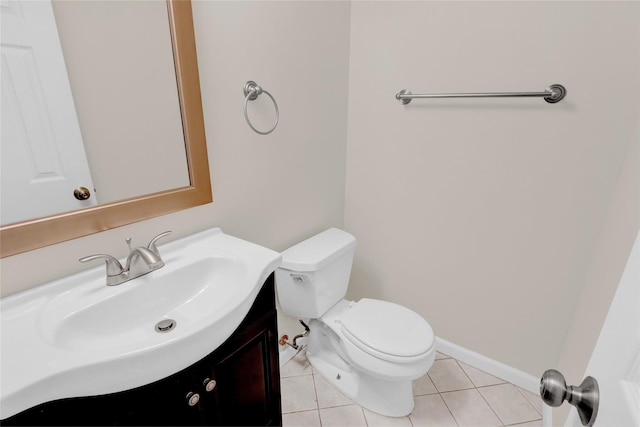 bathroom featuring tile patterned floors, vanity, and toilet