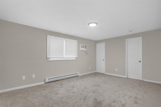 unfurnished room featuring light carpet, a wall unit AC, and a baseboard radiator