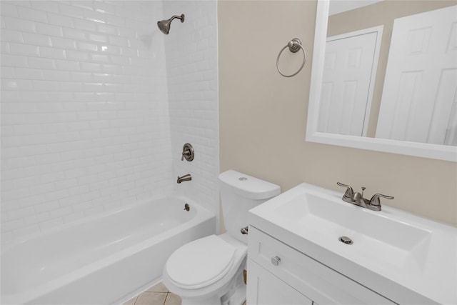 full bathroom featuring toilet, vanity, tiled shower / bath combo, and tile patterned flooring