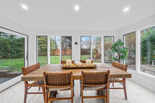 sunroom / solarium featuring a wealth of natural light