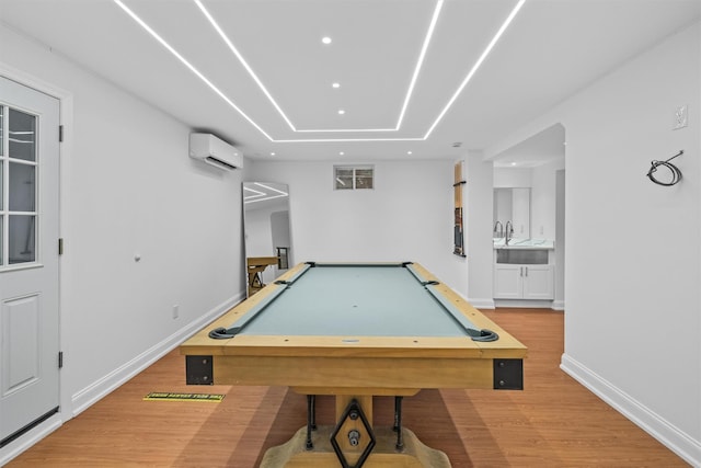 playroom featuring wood-type flooring, pool table, and a wall mounted AC